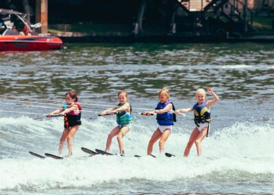 Tandem waterskiing at camp on Lake Austin